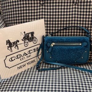 Coach small Rhyder teal shearling pouchette